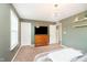 Bedroom featuring a chandelier, large TV, and neutral-colored walls, creating a serene ambiance at 5196 E County Road 100 S, Avon, IN 46123