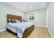 A cozy bedroom features a comfortable bed and natural light from a window well, creating a relaxing atmosphere at 5196 E County Road 100 S, Avon, IN 46123