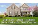 Charming two-story home with a stone facade, manicured lawn, and mature landscaping at 5196 E County Road 100 S, Avon, IN 46123