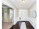 Inviting foyer with dark hardwood floors, white trim, and a view into adjacent rooms at 5196 E County Road 100 S, Avon, IN 46123