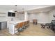 Finished basement with a wet bar, seating area, and foosball table offers ample recreation space at 5196 E County Road 100 S, Avon, IN 46123