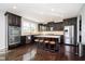 Gourmet kitchen with granite countertops, stainless steel appliances, and dark wood cabinets at 5196 E County Road 100 S, Avon, IN 46123