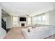 Bright living room with a fireplace, large sectional sofa, and plenty of natural light at 5196 E County Road 100 S, Avon, IN 46123