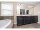 Spacious bathroom featuring a double vanity, soaking tub, and a separate shower area at 5196 E County Road 100 S, Avon, IN 46123