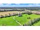Expansive aerial view of home, surrounded by lush greenery and mature trees, showcasing the property's serene setting at 5299 W Pr Black Hawk, Edinburgh, IN 46124