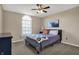Bedroom featuring a bed with soft bedding, a ceiling fan, and a window that brings in natural light at 5299 W Pr Black Hawk, Edinburgh, IN 46124