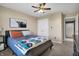 Bedroom with neutral walls, ceiling fan, and an open doorway leading to an adjacent room at 5299 W Pr Black Hawk, Edinburgh, IN 46124