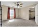Spacious bedroom featuring a ceiling fan, window, and an open walk-in closet at 5299 W Pr Black Hawk, Edinburgh, IN 46124