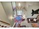 Open foyer with high ceilings, a decorative chandelier, and hardwood floors with a blue rug at 5299 W Pr Black Hawk, Edinburgh, IN 46124