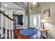 Grand foyer with hardwood floors and elegant decor, creating a sophisticated first impression at 5299 W Pr Black Hawk, Edinburgh, IN 46124