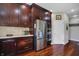 Kitchen featuring dark wood cabinets, stainless steel appliances, and granite countertops at 5299 W Pr Black Hawk, Edinburgh, IN 46124