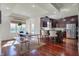 Open-concept kitchen and dining area featuring stainless steel appliances and an eat-in island with seating at 5299 W Pr Black Hawk, Edinburgh, IN 46124