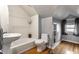 Cozy bathroom featuring a tub and sink, complemented by sleek fixtures and minimalist design at 5331 N New Jersey St, Indianapolis, IN 46220