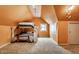Unique bedroom with bunk beds, carpeted floors, and an orange painted wall at 5331 N New Jersey St, Indianapolis, IN 46220