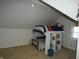 Bedroom features a unique lofted bed with built in shelving and a bright window at 5331 N New Jersey St, Indianapolis, IN 46220