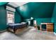 Bright bedroom featuring sloped ceilings, a desk, and a cozy bed with built-in storage at 5331 N New Jersey St, Indianapolis, IN 46220