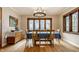 Elegant dining room with hardwood floors, large windows, and a chandelier at 5331 N New Jersey St, Indianapolis, IN 46220