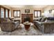 Cozy living room with a fireplace, hardwood floors, and comfortable seating at 5331 N New Jersey St, Indianapolis, IN 46220