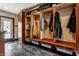 Mudroom with wood storage, tile flooring, and an exterior entrance at 5331 N New Jersey St, Indianapolis, IN 46220