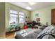 Comfortable office space with bright green walls, a skylight, and a gray couch at 5331 N New Jersey St, Indianapolis, IN 46220