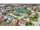 Picturesque aerial view of a residential community featuring well-manicured lawns and a serene central pond at 5549 Dill Ct, Indianapolis, IN 46237