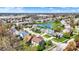 Scenic aerial view of a neighborhood highlighting lush greenery, a tranquil pond, and charming homes at 5549 Dill Ct, Indianapolis, IN 46237