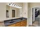 Bathroom boasting double sinks, granite countertop, and a walk-in closet for ample storage at 5549 Dill Ct, Indianapolis, IN 46237