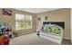 Bedroom with a storage bed, decor, and natural light from the windows, creating a cozy and inviting atmosphere at 5549 Dill Ct, Indianapolis, IN 46237