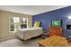 Bedroom featuring natural light, a charming desk area, and a cozy bed at 5549 Dill Ct, Indianapolis, IN 46237