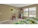 Bedroom featuring a window providing natural light, and playful wall decor at 5549 Dill Ct, Indianapolis, IN 46237