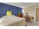 Bedroom featuring natural light, a charming desk area, and a cozy bed at 5549 Dill Ct, Indianapolis, IN 46237