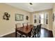 Elegant dining room featuring a modern chandelier, large bay window, and sleek decor for sophisticated gatherings at 5549 Dill Ct, Indianapolis, IN 46237