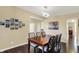 Cozy dining room with a wooden table, seating for six, and stylish artwork, perfect for Gathering meals and entertaining at 5549 Dill Ct, Indianapolis, IN 46237