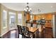 Bright eat-in kitchen with a center island, stainless steel appliances, and a breakfast table with chairs at 5549 Dill Ct, Indianapolis, IN 46237