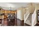 Open-concept kitchen and dining area with modern appliances, a staircase, and ample counter space, perfect for cooking at 5549 Dill Ct, Indianapolis, IN 46237