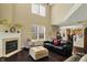 Inviting living room with a fireplace, comfortable seating, and large windows, perfect for relaxing with Gathering and friends at 5549 Dill Ct, Indianapolis, IN 46237