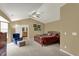 Spacious main bedroom features carpeted floors, a ceiling fan, and an ensuite bathroom at 5549 Dill Ct, Indianapolis, IN 46237