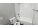 Bathroom featuring a shower and tub combination, a toilet and a white vanity at 5636 W Henry St, Indianapolis, IN 46241