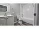 Bathroom featuring a shower and tub combination, a toilet and a white vanity at 5636 W Henry St, Indianapolis, IN 46241
