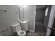 Bathroom featuring a white vanity with a rectangular mirror, toilet, and neutral color palette at 5636 W Henry St, Indianapolis, IN 46241