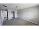 Neutral bedroom featuring plush carpet, a ceiling light, and a closet with bi-fold doors at 5636 W Henry St, Indianapolis, IN 46241
