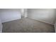 An empty living room with neutral walls and flooring awaits personal touches, and provides a calm, inviting atmosphere at 5636 W Henry St, Indianapolis, IN 46241