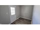 Mud room with modern plank flooring, a utility hookup, and an exterior door with glass panes at 5636 W Henry St, Indianapolis, IN 46241