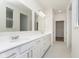 Bright bathroom features white double sink vanity, tiled floor, and a large mirror at 5661 Stetson Dr, Whitestown, IN 46052