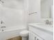 Bright bathroom featuring a tub-shower combo, modern vanity, and stylish fixtures at 5661 Stetson Dr, Whitestown, IN 46052