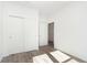 Sunlit bedroom features hardwood floors and white sliding closet doors at 5661 Stetson Dr, Whitestown, IN 46052