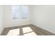 Cozy bedroom features hardwood floors and a large window at 5661 Stetson Dr, Whitestown, IN 46052