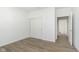 Neutral bedroom features hardwood floors and white closet doors at 5661 Stetson Dr, Whitestown, IN 46052