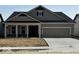 Charming single-Gathering home featuring a two-car garage, covered entryway, and pleasant neutral color scheme at 5661 Stetson Dr, Whitestown, IN 46052