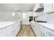 Well-lit kitchen with a large island, updated appliances, and a gas stovetop at 5661 Stetson Dr, Whitestown, IN 46052